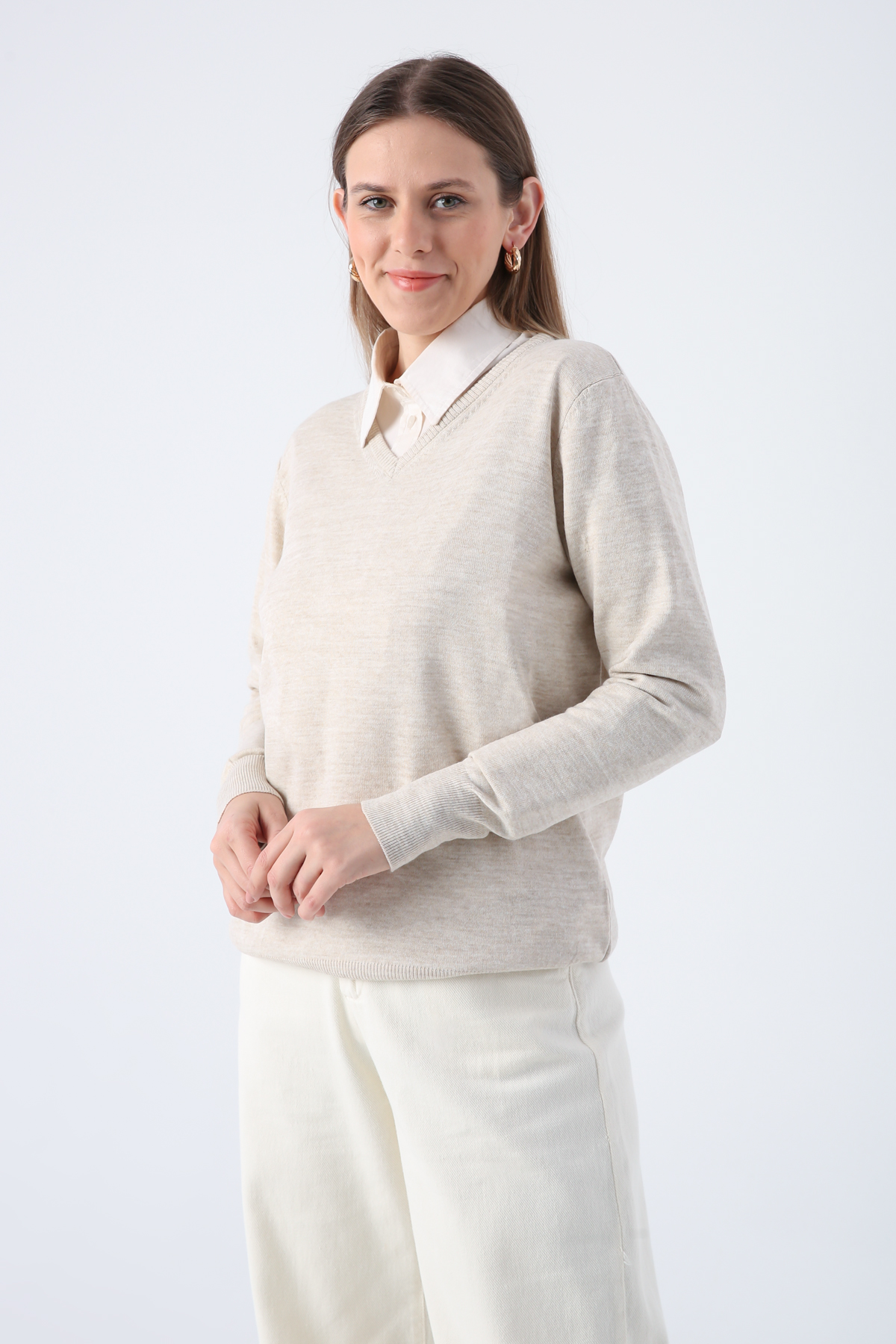 A model wears ALL11346 - V Neck Knitwear Sweater - Stone, wholesale Sweater of Allday to display at Lonca