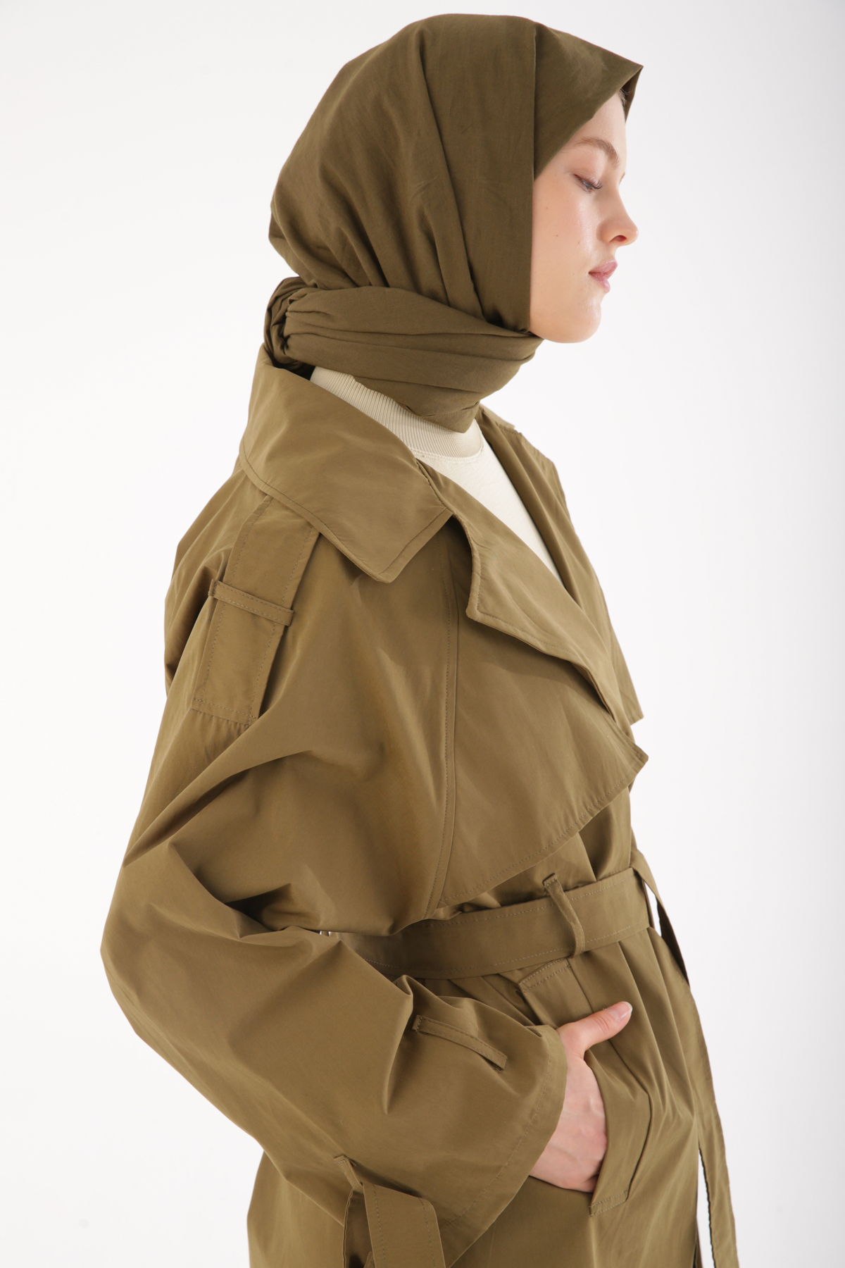 A model wears ALL11729 - Belted Snap Trench Coat - Khaki, wholesale Trenchcoat of Allday to display at Lonca