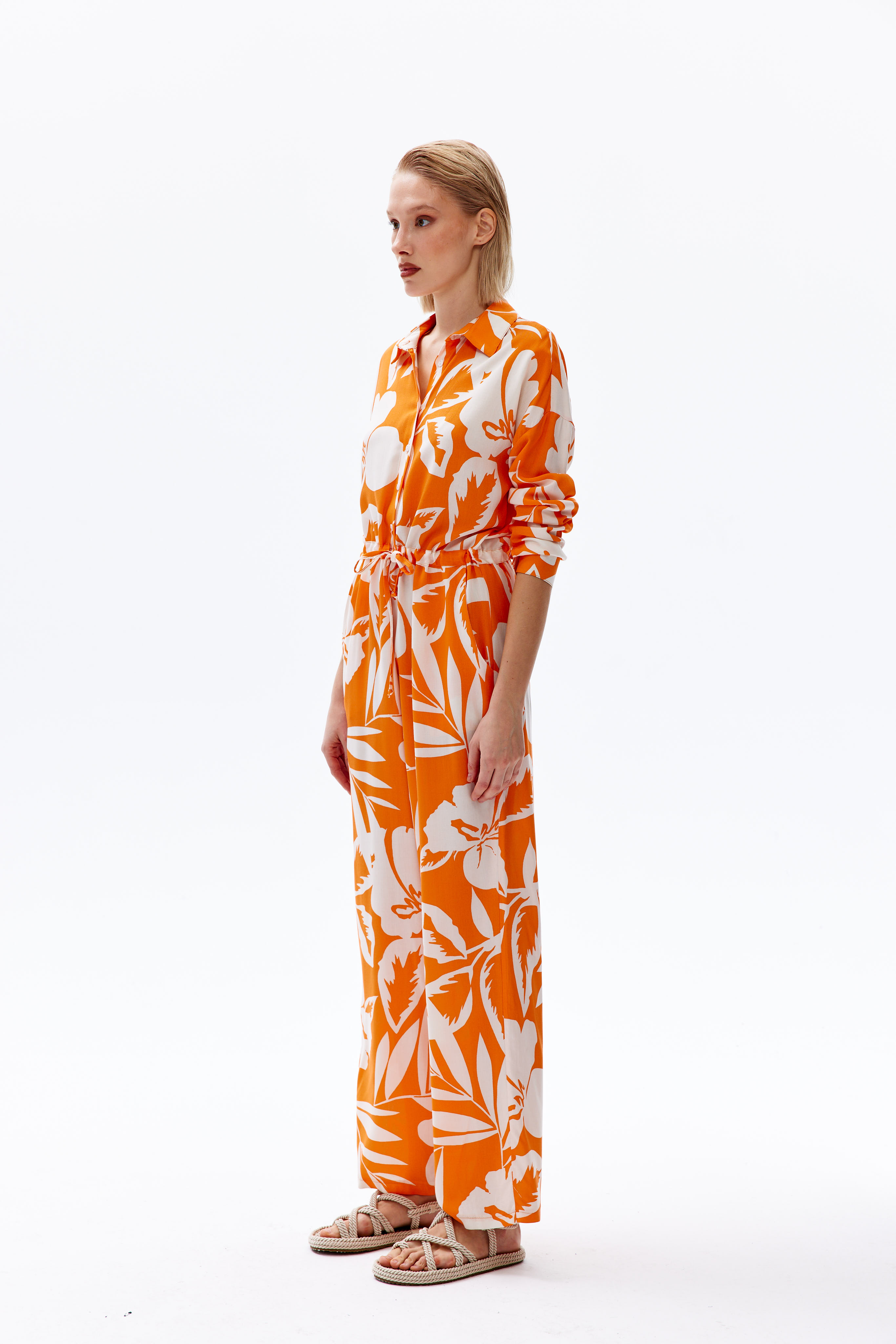 A model wears 44112 - Overalls - Orange, wholesale Jumpsuit of Cream Rouge to display at Lonca