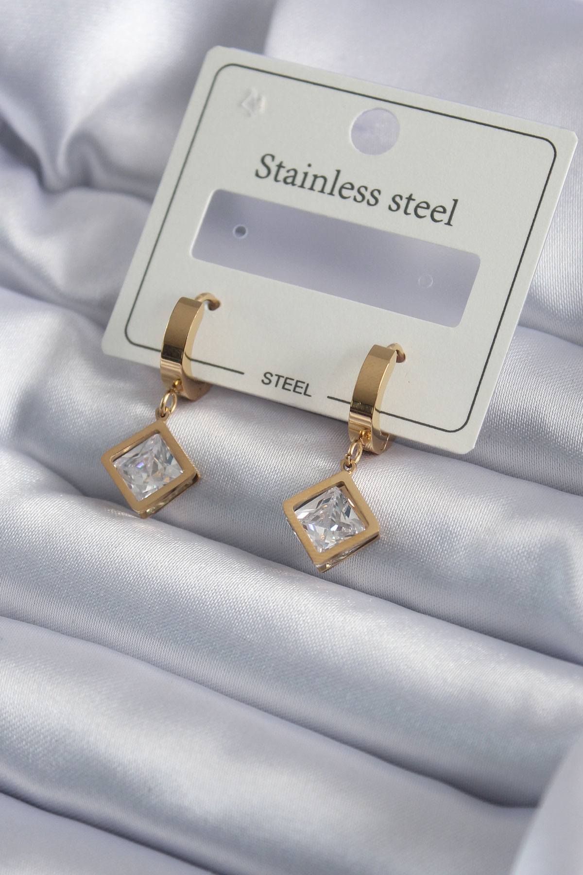 A wholesale clothing model wears ebj14675-316l-steel-gold-color-square-zircon-stone-model-women's-earrings, Turkish wholesale Earring of Ebijuteri