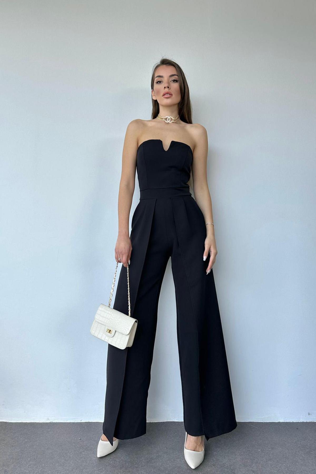 A model wears ELS10151 - Slit Detailed Strapless Jumpsuit - Black, wholesale Jumpsuit of Elisa to display at Lonca