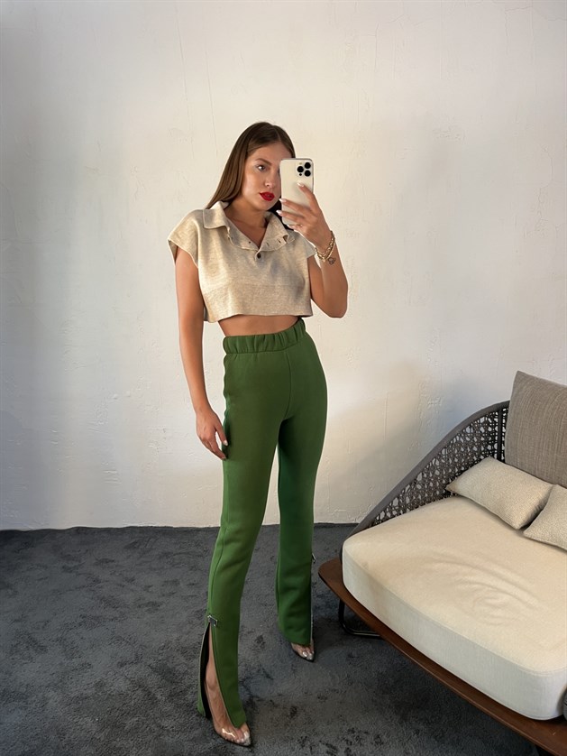 A wholesale clothing model wears Sweatpants - Green, Turkish wholesale Sweatpants of Fame