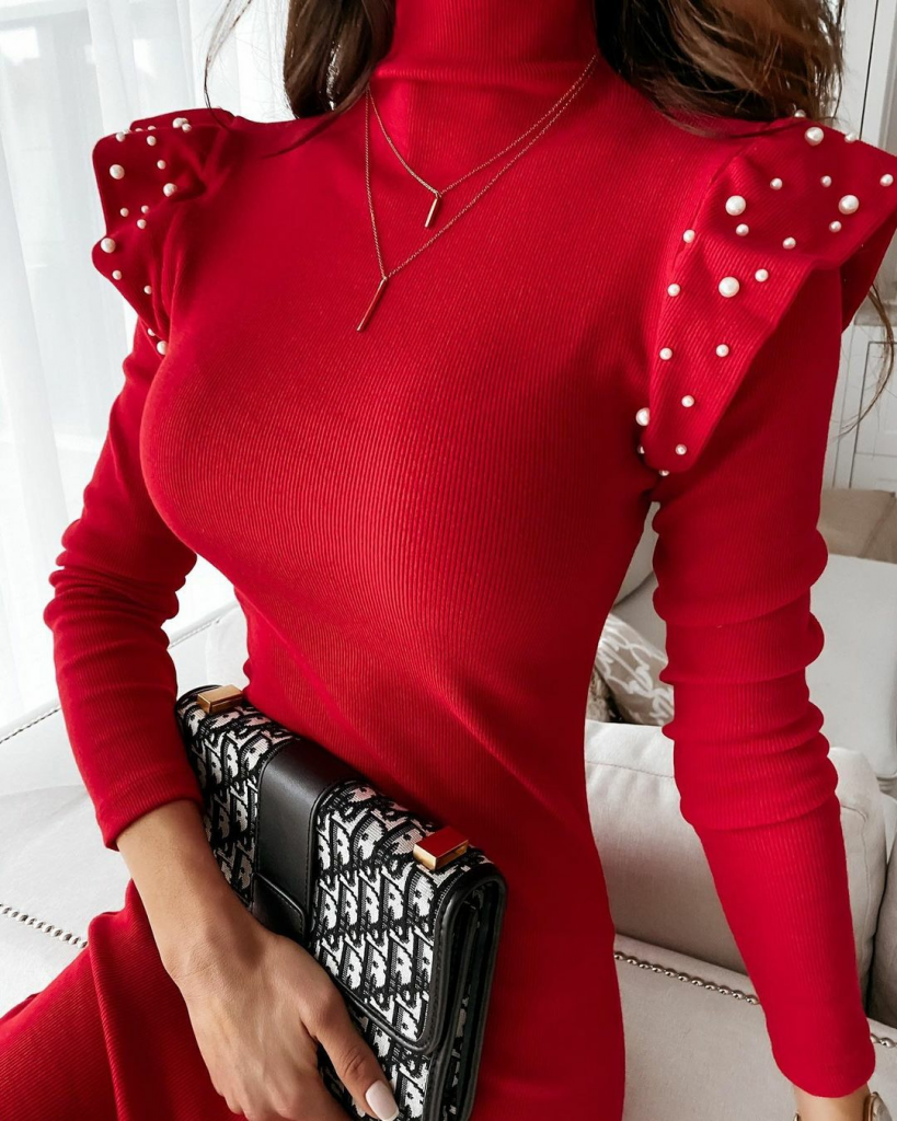A model wears JAN11532 - Women's Red Long Sleeve Turtleneck Shoulder Pleat Pearl Detail Camisole Dress - Red, wholesale Dress of Janes to display at Lonca