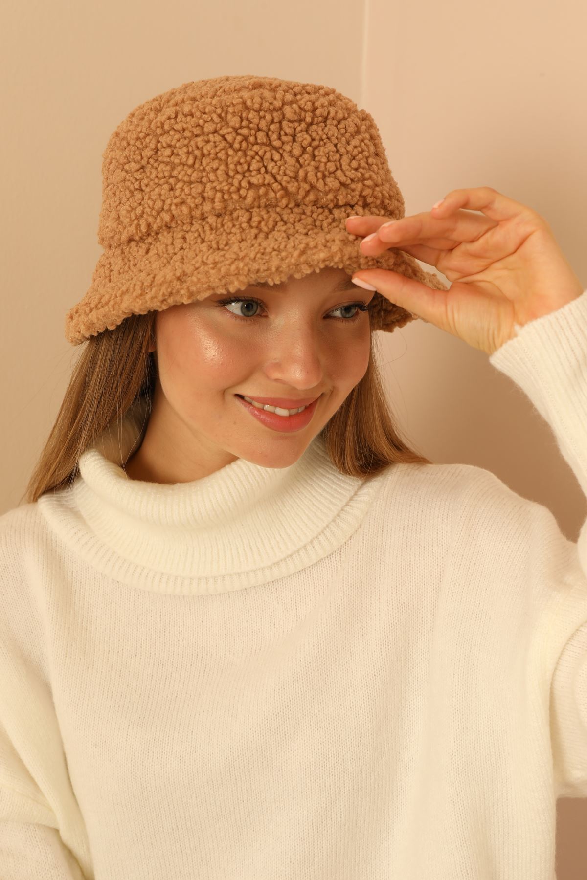 A model wears KAM11476 - Curly Bucket Women's Hat - Camel, wholesale Hat of Kaktus Moda to display at Lonca