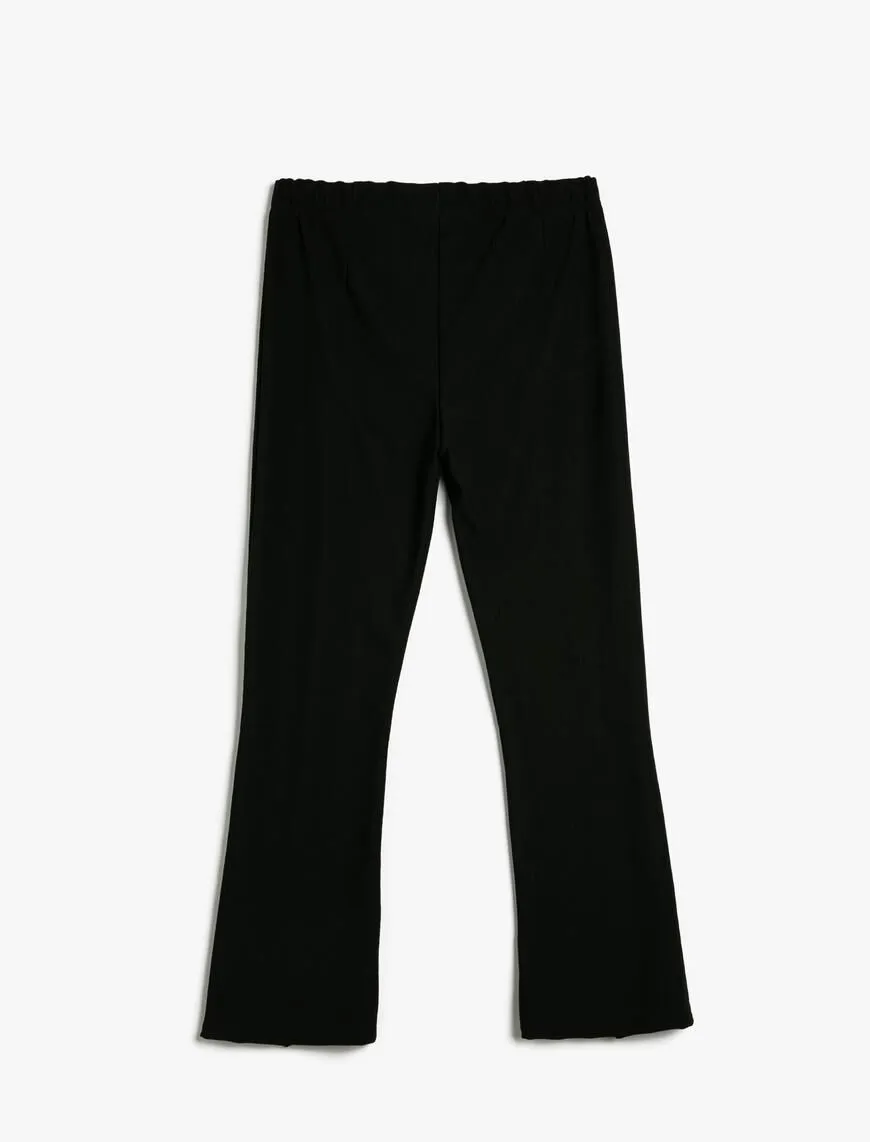 A wholesale clothing model wears High Waist Flare Leg Tights - Black, Turkish wholesale Leggings of Koton