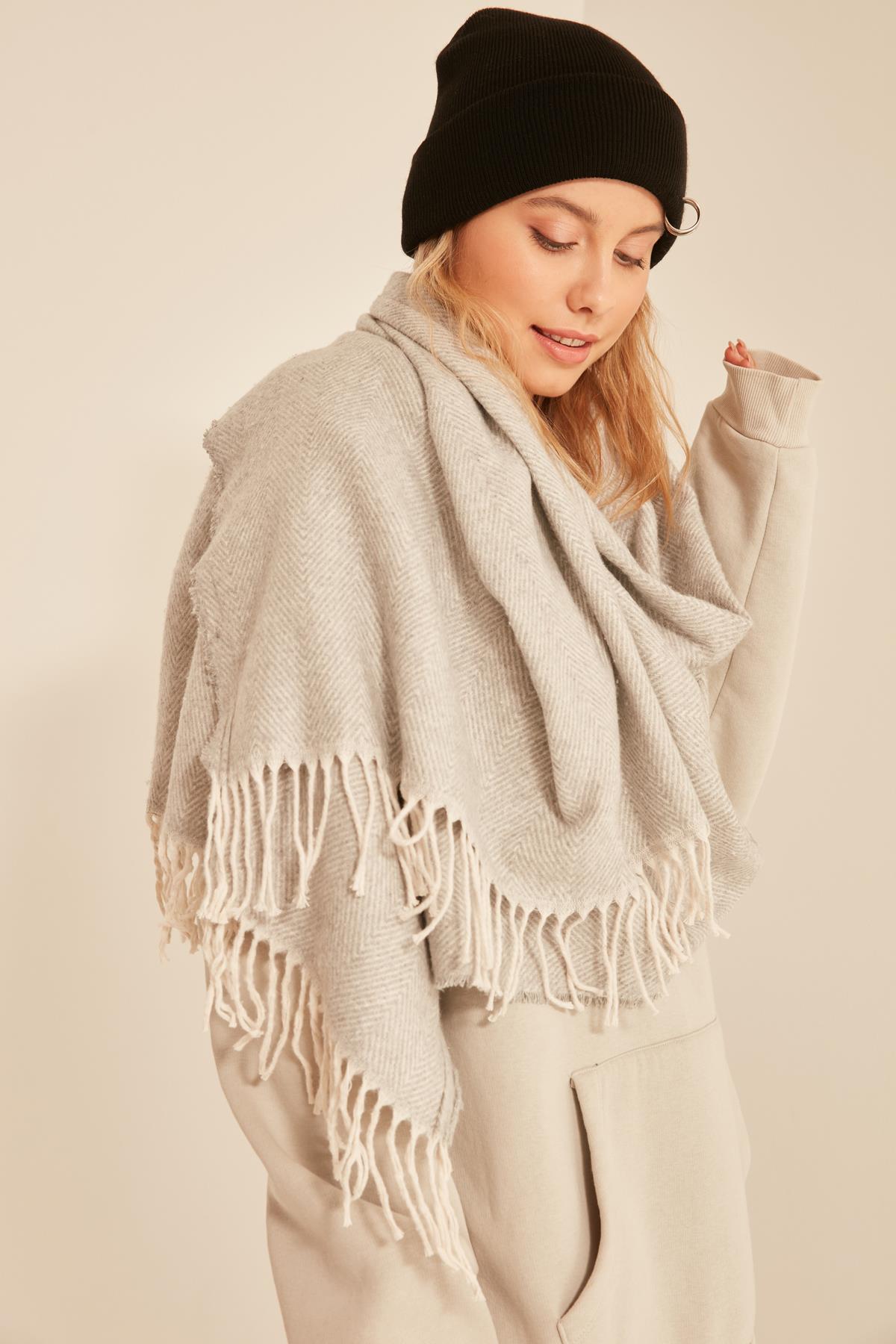 A model wears NSV10832 - Soft Textured Tassels Light Thick Shoulder Shawl - Gray, wholesale Shawl of Nesvay to display at Lonca