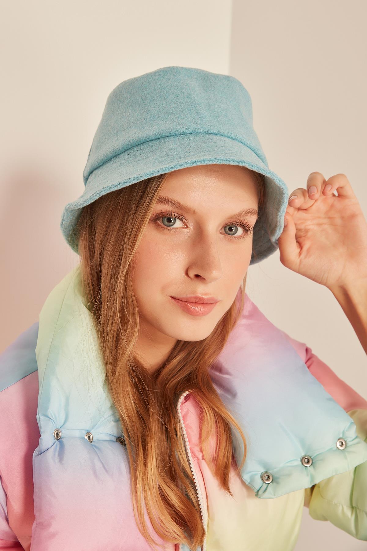 A model wears NSV11142 - Stamped Baby Bucket Hat - Blue, wholesale Hat of Nesvay to display at Lonca
