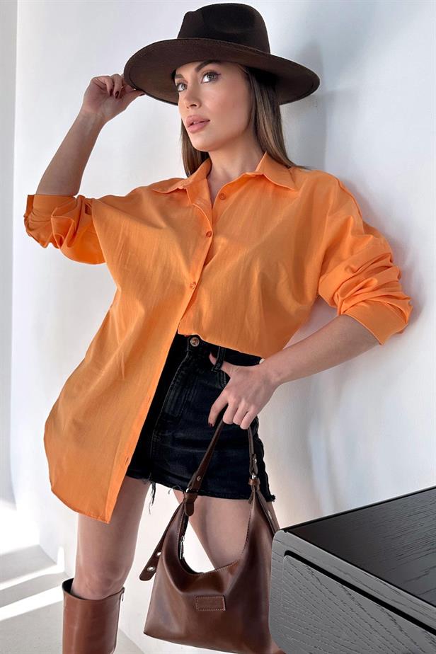 A model wears REY10808 - Basic Poplin Shirt - Orange, wholesale Shirt of Reyon to display at Lonca